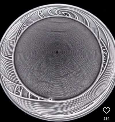 A Sisyphus table creates kinetic art using a single marble