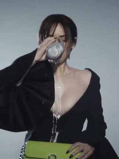 Winona Ryder spilling milk over her tits