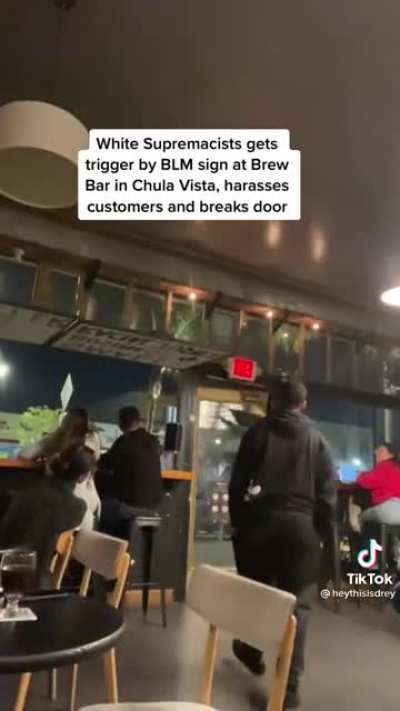 Man gets pissed that bar has BLM sign up, freaks out and breaks door on his way out.
