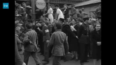 French civilians mistreat British and U.S. POWs as they are marched through the streets of Paris, hitting and spitting on them. (Least spineless Pierre)