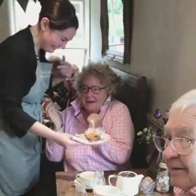A regular customer's heartwarming reaction to a free cake on her birthday