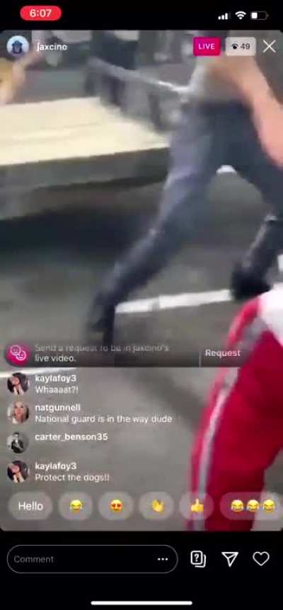 Crazy old man attacks protesters with bow & arrow; his car pays the price.