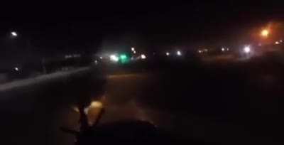 Mexican federal police officer firing on heavily armed members of the Cartel de Noreste (CDN) with a vehicle mounted M249 during a high speed chase in the streets of Nuevo León, Mexico