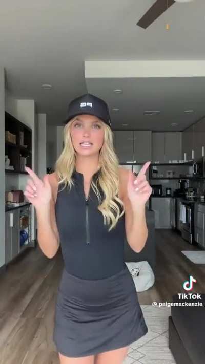 All black golf outfit.