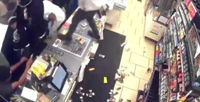 Large crowd of people looting a 7/eleven in Los Angeles California