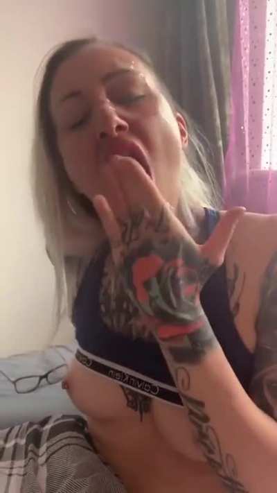 Licking cum off her glasses