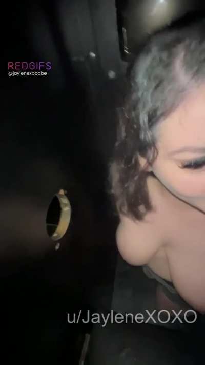 A stranger sticks their cock in the hole for me to play with and suck while my husband watches. Then he gropes my big titties while I get his cock hard