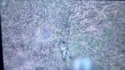 Russian soldier panicking while trying to shoot down the drone was hit with a grenade drop