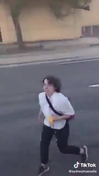 Girl tries to steal a Trump flag off of a pickup truck in Portland.