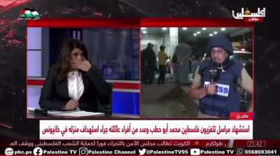Journalist in Gaza removes his protective uniform after the killing of colleague Mohammed Abu Hatab: