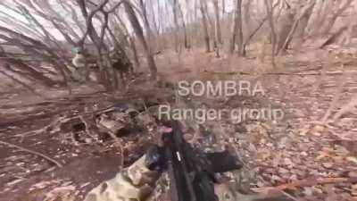 Brazilian volunteer soldier and his Ukrainian broth<wbr>ers-i<wbr>n-arm<wbr>s encounter a Russian soldier in a forest in the Luhansk. The Russian suddenly reaches for his rifle.
