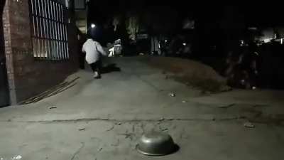 Kids playing with a firecracker