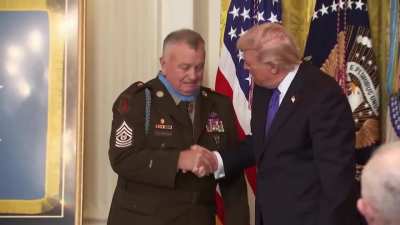 Trump places improperly sized medal on recipient