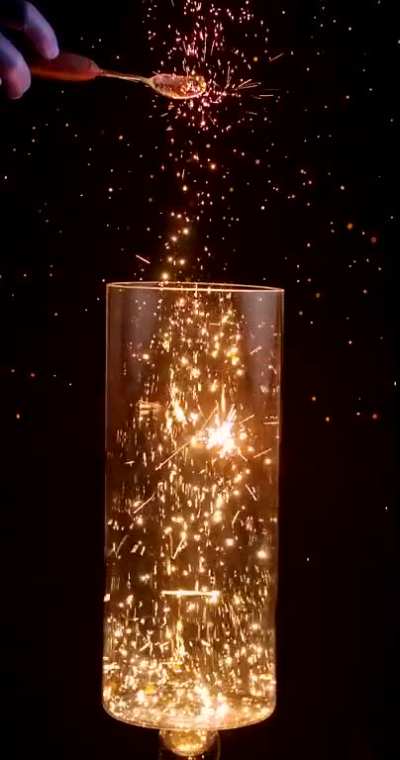 Pouring Burning Charcoal Dust into Oxygen in Slow Motion
