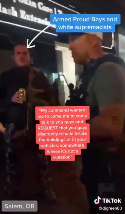POLICE OFFICER TELLS PROUD BOYS TO HIDE INSIDE BUILDING BECAUSE THEY'RE ABOUT TO TEAR GAS PROTESTERS. THE OFFICER SAID HE WAS WARNING THEM “DISCREETLY” BECAUSE HE DIDN’T WANT PROTESTORS TO SEE POLICE “PLAY FAVORITES.” WAIT FOR HIS FACE AT THE EN
