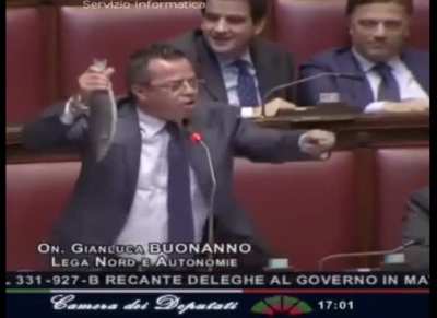 Italian politician pulls out a fish and starts shouting in the parliament. Because why not?