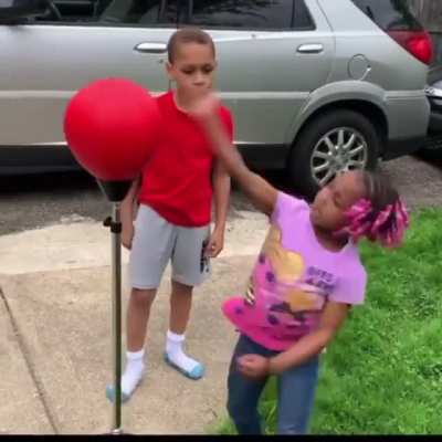 Brother showing sister how it’s done.