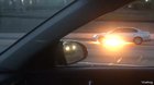 Person driving doesn’t seem to notice their car is on fire