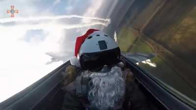 Santa piloting Ukrainian Mig-29, delivering coal to the Russians in the form of air to surface missiles