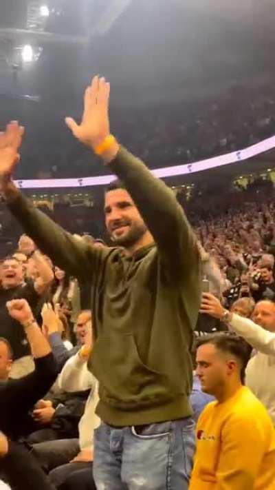 a whole crowd chanting for Aleksandar Mitrović who is in the crowd