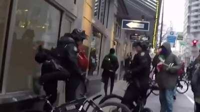 Seattle Police officers were recorded running into pedestrians with their bikes and arresting the victims for assault.