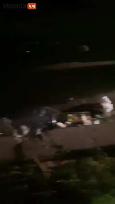 Racist woman dumps her trash in front of a stranger's house.