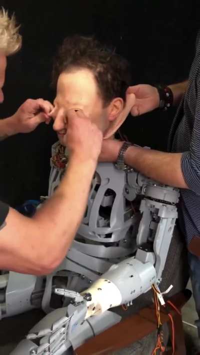 Putting a human mask on a humanoid robot