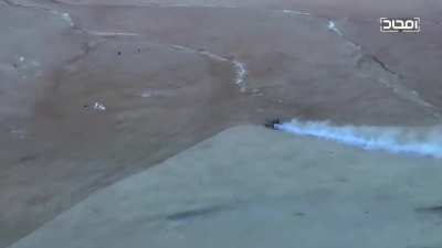 Hayat Tahrir al-Sham (HTS) crush two fleeing IS fighters with a tank. Eastern Hama in late 2017