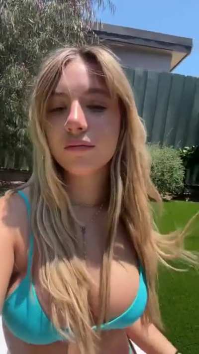 In a blue bikini 