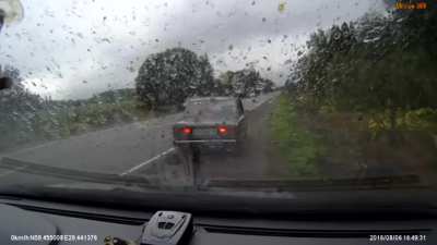 Four people (from what I can see) getting flung from their car