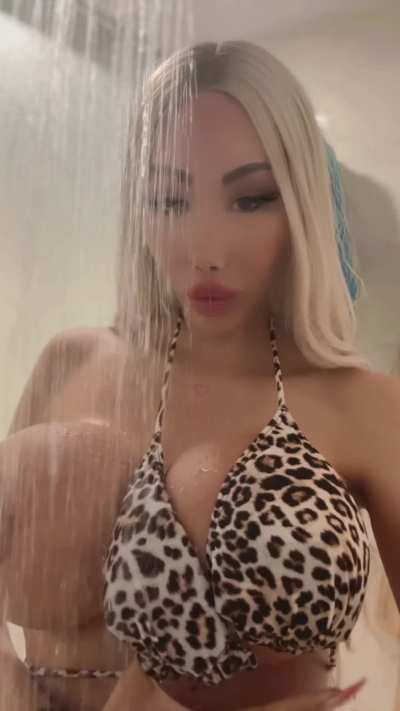 I love spraying my big fake tits with water