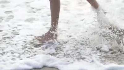Kelly Rohrbach running on beach