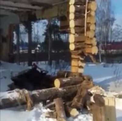 Standing under the structure while taking down a wall.