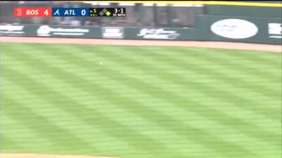 J.D. Martinez tries to go from first to third with Ronald Acuña Jr. manning right field.