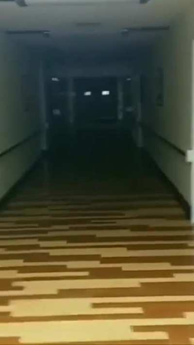 Ghost in hospital peeks out at me as I walk by