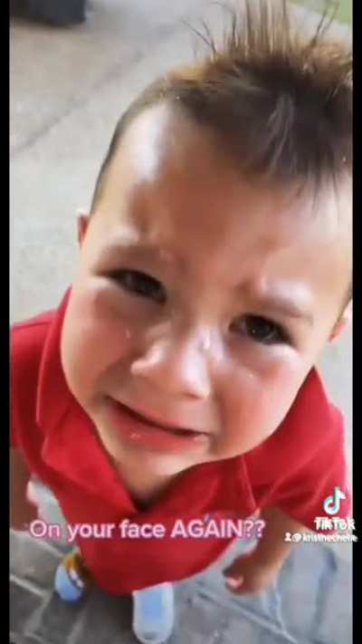 Kid pees on his own face.
