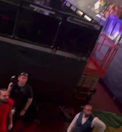 Drake tries to fight some guy in the crowd in his tour, who started trying to fight the girl who caught the towel Drake threw.