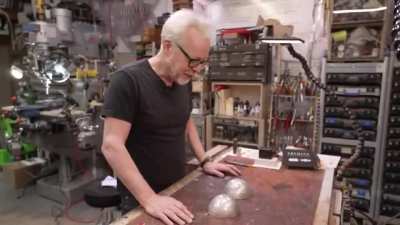 A tin foil ball in half