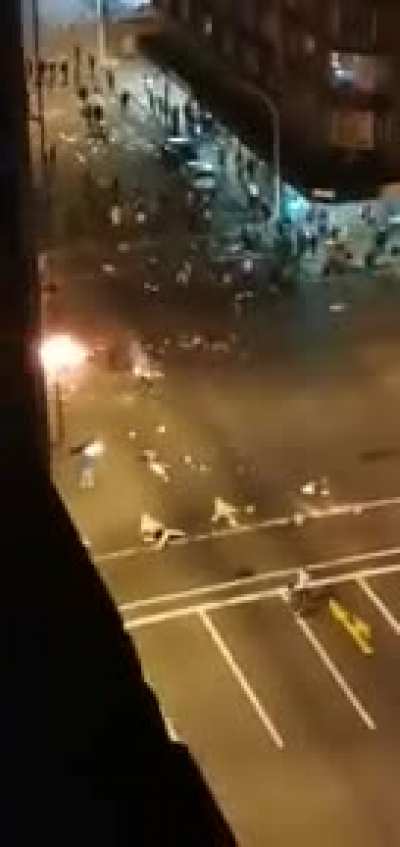 Violent rioters throwing rocks at taxi during protests in South Africa