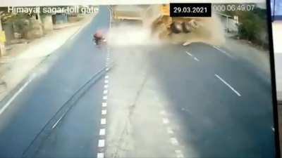 Reckless Biker Causes Two Trucks To Crash