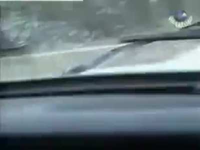 [Chechnya] Chechen mujahideen ambush a Russian military jeep with a PKM while driving. Second Chechen War. *Early 2000s*