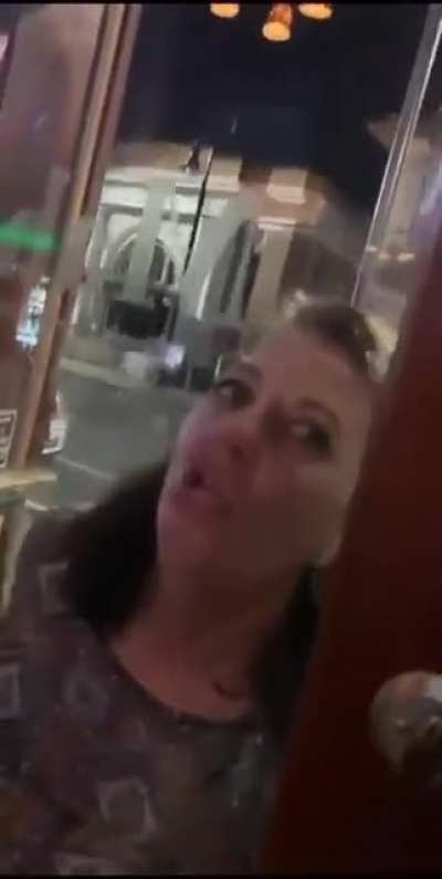 angry monster zombie attacks people in a bar.