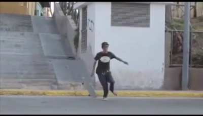 Guy tries skateboarding down a concrete stairwell. The stairwell is right next to the road. I hope the bus is ok.