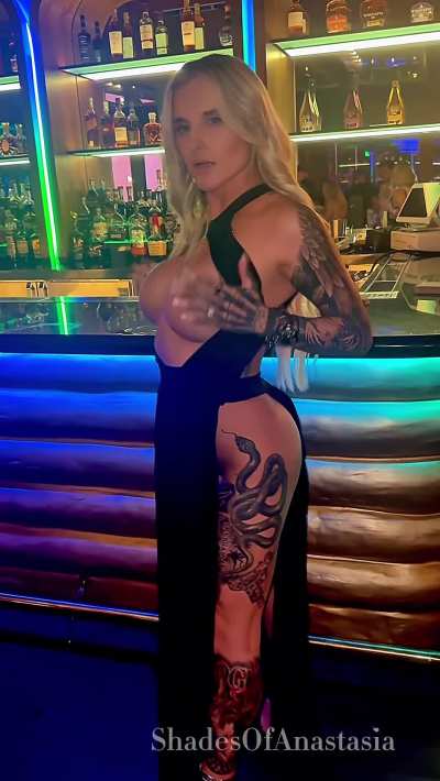 Showing my big lips under my dress while waiting for a drink
