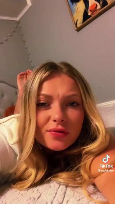 white girl shows feet while doing emotional cringe tiktok