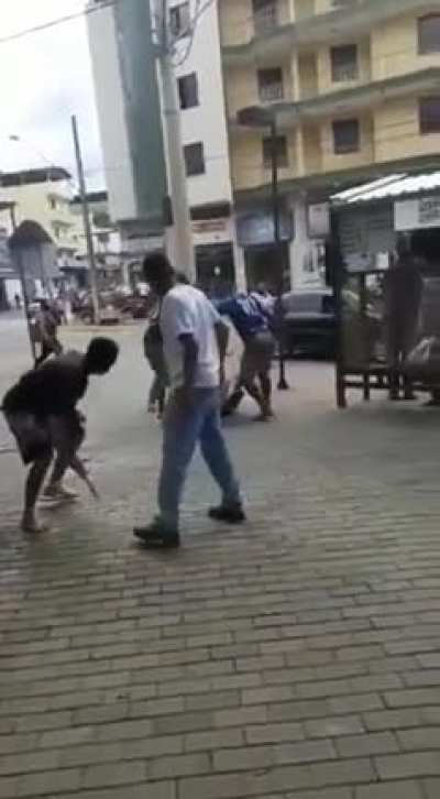 Man is seen hitting a woman In public but he doesn't realize that brazilians like to take the law Into their own hands