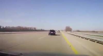 Changing tire in the middle of highway