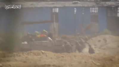 Palestinian militants target Israeli soldiers with machine gun.