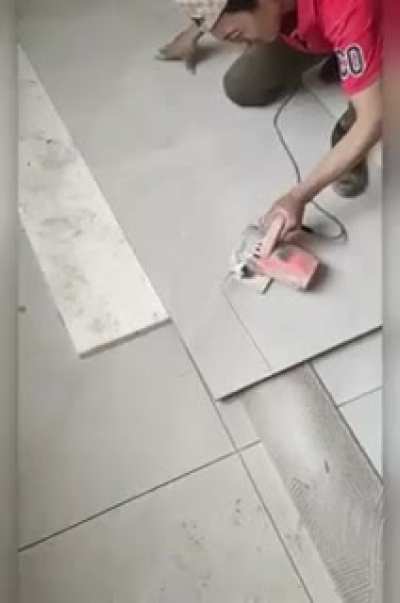 this tile worker doing his job