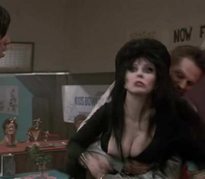 Cassandra Peterson's nip slip - Elvira: Mistress of the Dark (1988)